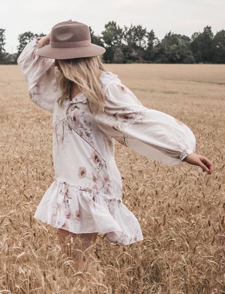 Woman wearing a boho dress in a field